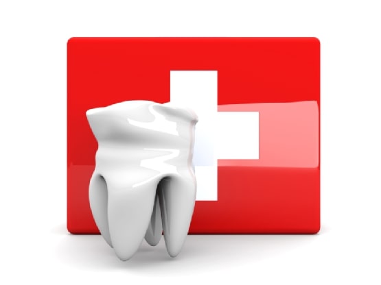 Tooth in front of red cross symbol