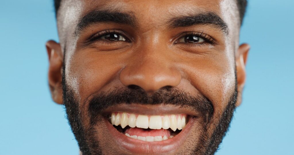 Young African-American man with a beautiful, bright smile. 