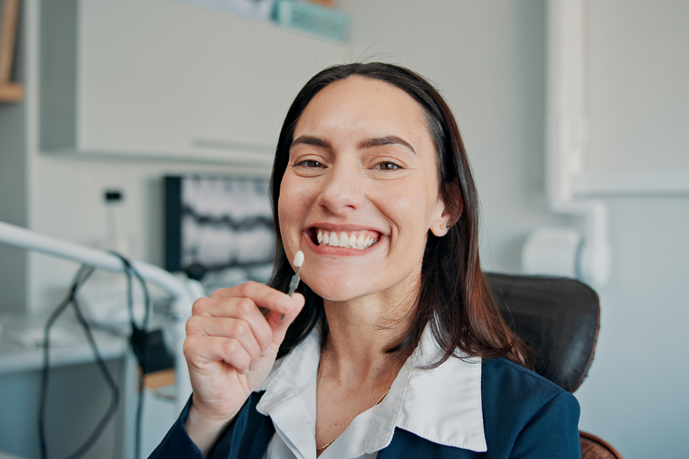 Happy patient smiling after successful dental crown results at Art of Modern Dentistry Chicago